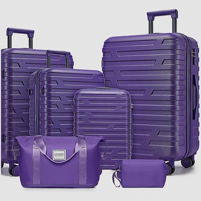 BritBag luggage collection featuring multiple hardshell suitcases in vibrant colours